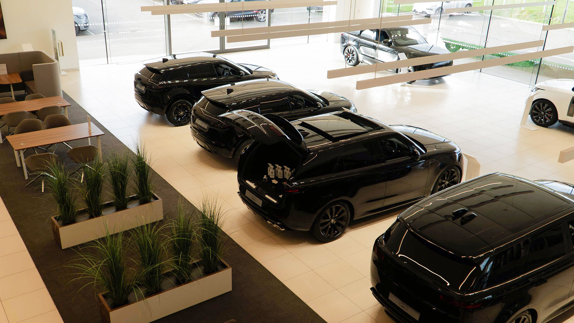 Cars in Land Rover dealership showroom